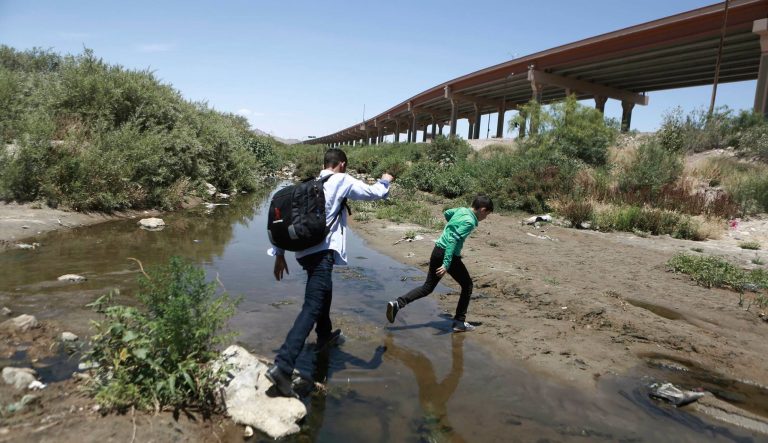 Migrants cross the Rio Grande into the United States, to turn themselves over to authorities and ask for asylum, as seen from Ciudad, Juarez, Friday, June 7, 2019. 