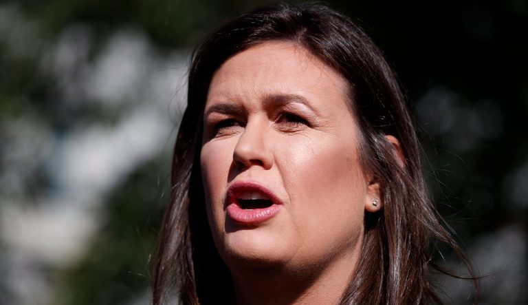 White House press secretary Sarah Sanders talks with reporters outside the White House, Tuesday, June 11, 2019, in Washington. 