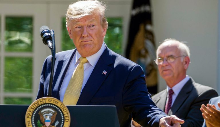 President Donald Trump points to a member of the audience in the Rose Garden of the White House, Friday, June 14, 2019, in Washington. 