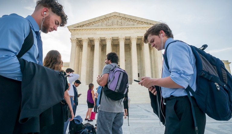 Visitors line up at the Supreme Court in Washington as the justices prepare to hand down decisions.
