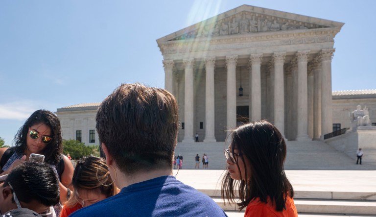 People gather near the Supreme Court in Washington.