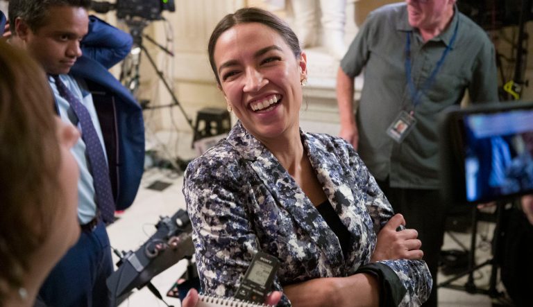 Rep. Alexandria Ocasio-Cortez, D-N.Y., talks with reporters on Capitol Hill, Thursday, June 27, 2019 in Washington. 