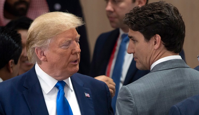 Canadian Prime Minister Justin Trudeau, right, speaks with United States President Donald Trump at the start of the a plenary session at the G20 Summit in Osaka, Japan, Saturday, June 29, 2019. 
