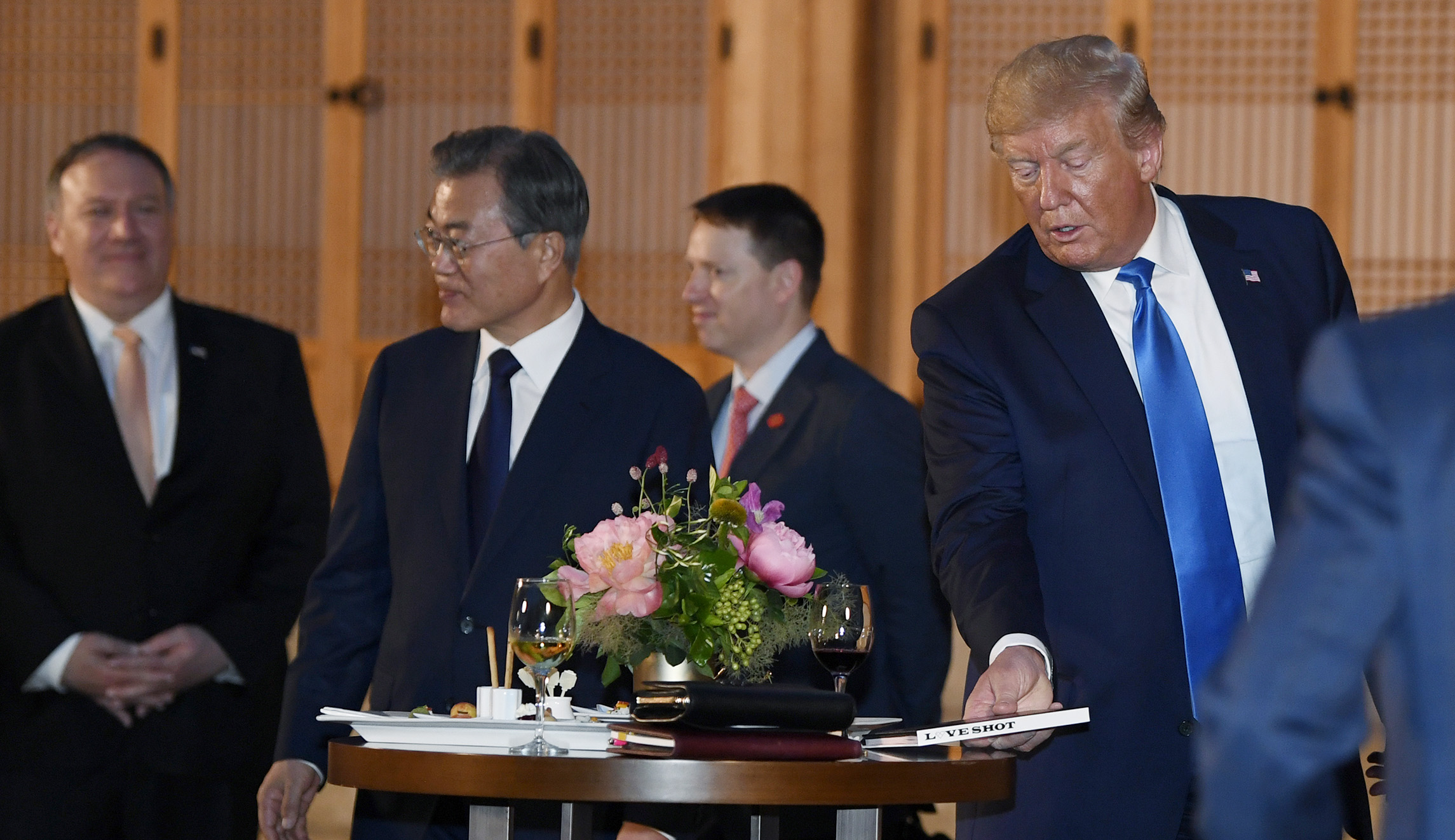 Trump given K-pop album Love Shot during welcome in South Korea