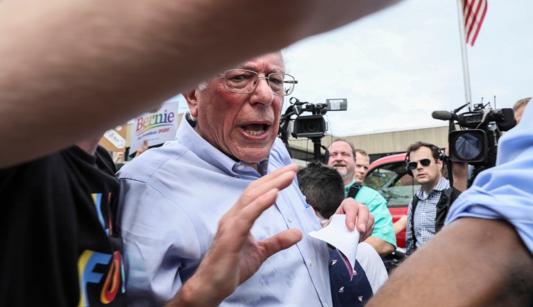 Democratic presidential candidate Sen. Bernie Sanders, I-Vt., turns down media questions before marching in the Nashua Pride Parade in Nashua, N.H.