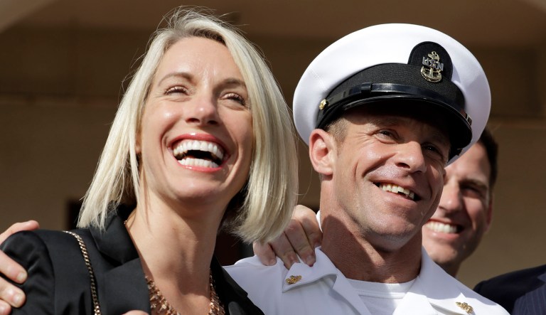 Navy Special Operations Chief Edward Gallagher, left, and his wife, Andrea Gallagher smile after leaving a military court on Naval Base San Diego.