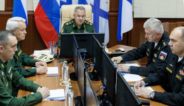 In this photo taken on July 3, 2019, and distributed by Russian Defense Ministry Press Service, Russian Defense Minister Sergei Shoigu, center, speaks at the navy's Arctic base of Severomorsk, Russia. Some crew members have survived a fire that killed 14 sailors onboard one of the Russian navy's deep-sea research submersibles, the nation's defense minister said Wednesday. 