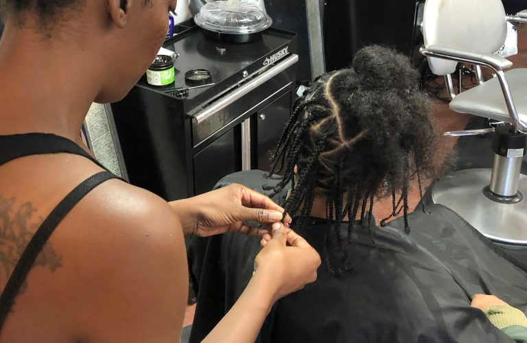 Shana Bonner, left, styles the hair of Pho Gibson at Exquisite U hair salon in Sacramento, Calif., Wednesday, July 3, 2019.