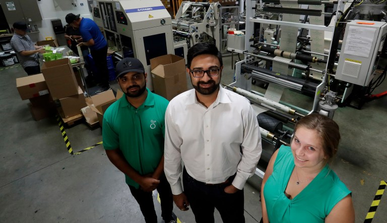 Achyut Patel, Director of Operations, Rudy Patel, Director of Business Development, and Katrina Hart, business development coordinator, pose for a picture at Beyond Green, a maker of biodegradable bags in Lake Forest, Calif.