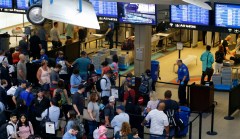 TSA union president says hiring and overtime freeze will cause travel delays
