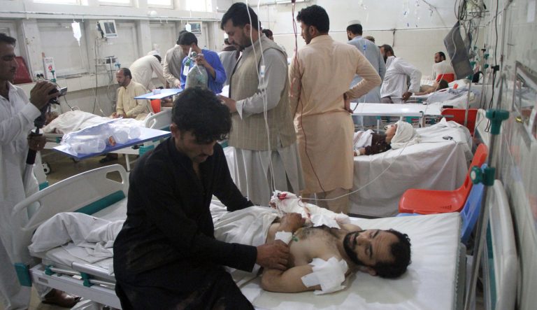 A wounded man receives treatment in a hospital after a suicide attack on the outskirts of Nangarhar province east of Kabul, Afghanistan, Friday, July 12, 2019.  A 13-year old suicide bomber blew himself up at a wedding early Friday in eastern Afghanistan's Nangarhar province, killing five people and injuring 11 others, police officials said. 