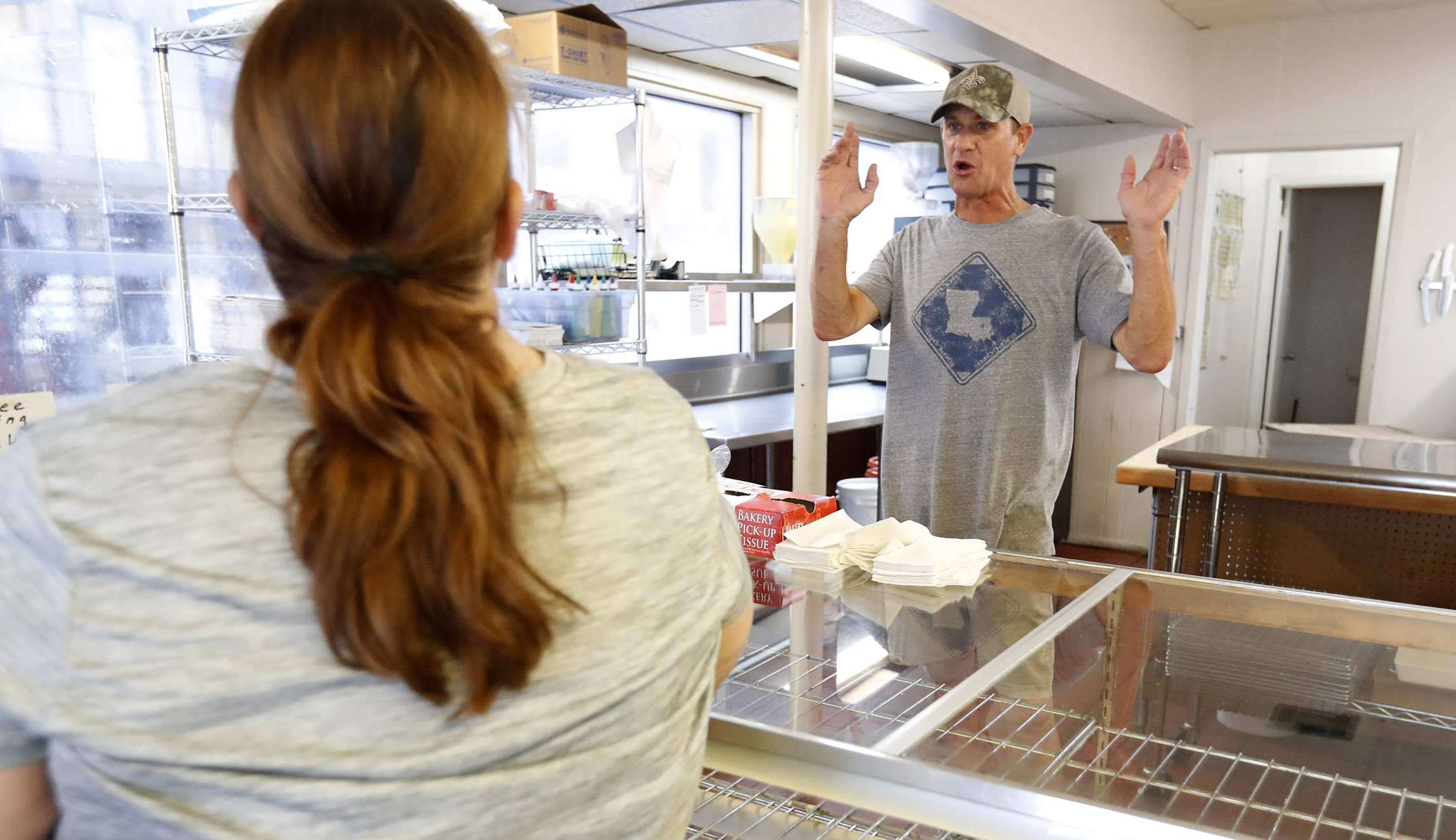 Todd Hoffpauir apologizes to a customer that he was out of inventory at his Morgan City, Louisiana, donut shop on Saturday. Hoffpauir had not intended to open his business, because of the threat of Tropical Storm Barry to the area, but he said once the police from the station next door saw he was in the building, the demand was overwhelming and he ended up making and selling donuts for over five hours.
