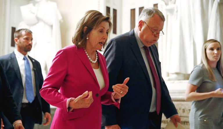 House Speaker Nancy Pelosi of California walks out of the House chamber on Capitol Hill in Washington.
