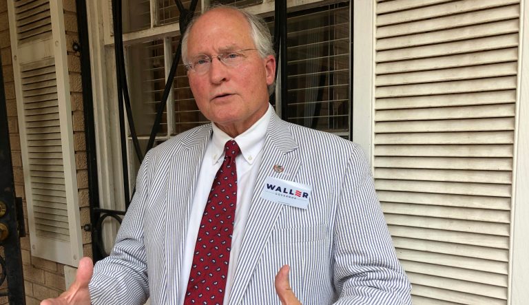 In this Monday, July 15, 2019 photo, Bill Waller Jr., a former Mississippi Supreme Court justice who is running as a Republican for Mississippi governor, speaks to journalists, outside the state Republican headquarters in downtown Jackson, Miss. 