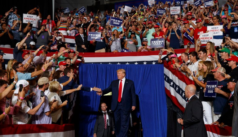 President Trump arrives to speak at a campaign rally at Williams Arena in Greenville, North Carolina.