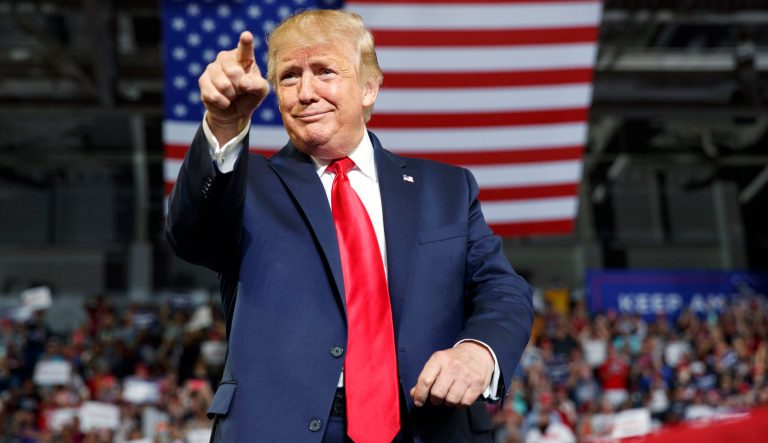 President Donald Trump gestures to the crowd as he arrives to speak at a campaign rally at Williams Arena in Greenville, N.C., Wednesday, July 17, 2019. 