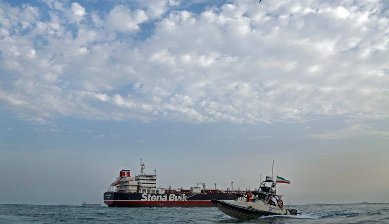 A speedboat and a helicopter of the Iran's Revolutionary Guard move around a British-flagged oil tanker Stena Impero which was seized on Friday by the Guard, in the Iranian port of Bandar Abbas, Sunday, July 21, 2019. 