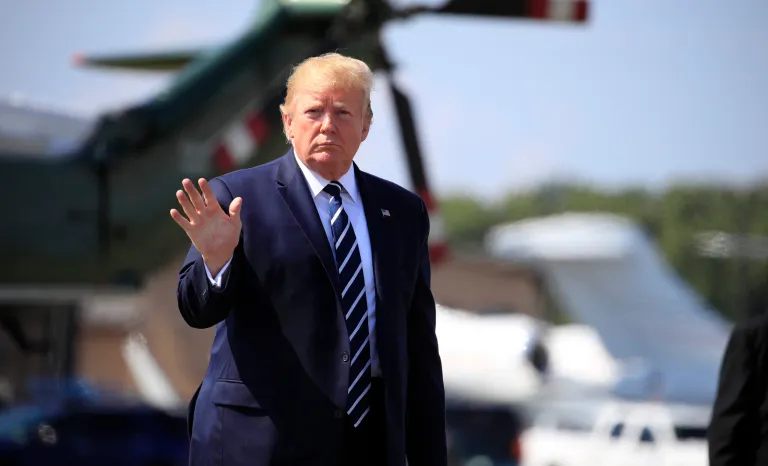 President Donald Trump walks on the tarmac to board Air Force One at Morristown Municipal Airport, in Morristown, N.J., on his way returning back to the White House Sunday, July 21, 2019. 