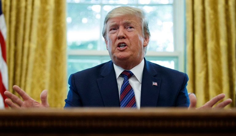 President Trump speaks in the Oval Office of the White House in Washington.