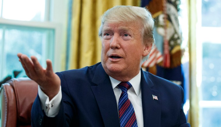 President Trump speaks in the Oval Office of the White House in Washington.