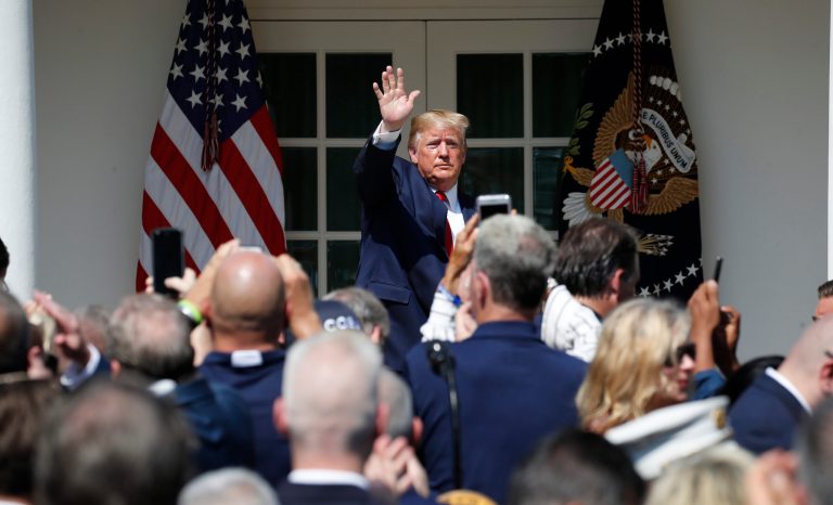 President Donald Trump waves after signing H.R. 1327, an act ensuring that a victims' compensation fund related to the Sept. 11 attacks never runs out of money, in the Rose Garden of the White House, Monday, July 29, 2019, in Washington. 