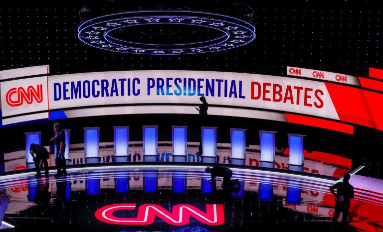 Workers get the stage ready for the Democratic primary debate hosted by CNN Tuesday at the Fox Theatre in Detroit. 