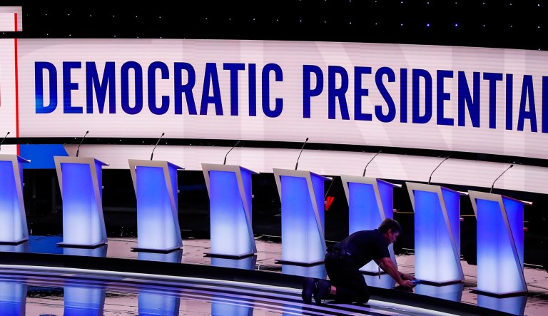 Workers get the stage ready for the Democratic primary debate hosted by CNN Tuesday at the Fox Theatre in Detroit. 