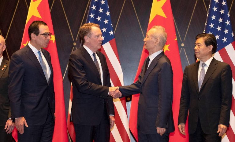 United States Trade Representative Robert Lighthizer, center left, shakes hands with Chinese Vice Premier Liu He as U.S. Treasury Secretary Steven Mnuchin looks on, left, with Chinese Commerce Minister Zhong Shan, right, after an official photo session at the Xijiao Conference Center in Shanghai on Wednesday, July 31, 2019. 