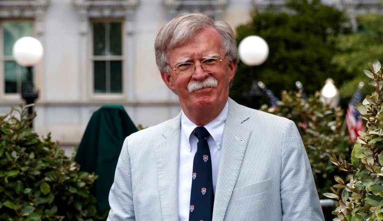 National security adviser John Bolton walks to speak.