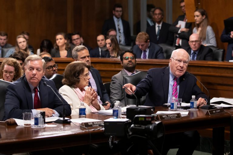Senate Judiciary Committee Chairman Lindsey Graham, R-S.C., far left, and Sen. Dianne Feinstein, D-Calif., the ranking member, listen as Sen. Patrick Leahy, D-Vt., far right, a former chairman of the committee, charges Graham with breaking with normal rules of procedure as Graham tries to change asylum laws as a way to address the migrant crisis at the southern border, but without input from the Democrats, on Capitol Hill in Washington, Thursday, Aug. 1, 2019. 