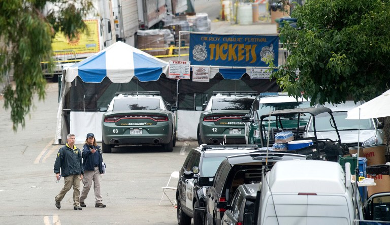 FBI personnel pass a ticket booth at the Gilroy Garlic Festival in California the morning after a gunman killed multiple people and wounded over a dozen others.