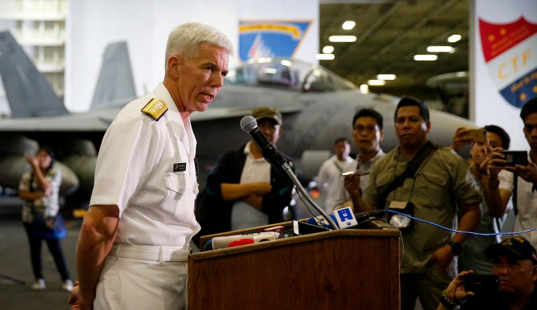 U.S. Rear Adm. Karl Thomas, commander of the Battle Force 7th Fleet, addresses the media aboard the U.S. aircraft carrier USS Ronald Reagan as it is anchored off Manila Bay, Philippines, on Wednesday.