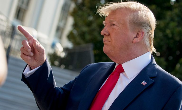 President Donald Trump takes a question from a member of the media on the South Lawn of the White House in Washington, Wednesday, Aug. 7, 2019.