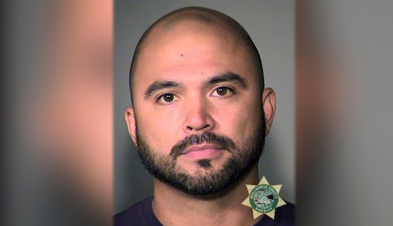 This booking photo provided by the Multnomah County Sheriff's Office shows Patriot Prayer leader Joey Gibson on Friday. Authorities arrested Gibson, the leader of the right-wing group, on the eve of a rally that's expected to draw people from around the U.S. to Portland, Oregon, on Saturday, prompting Gibson to urge his followers to "show up one hundred-fold" in response. 