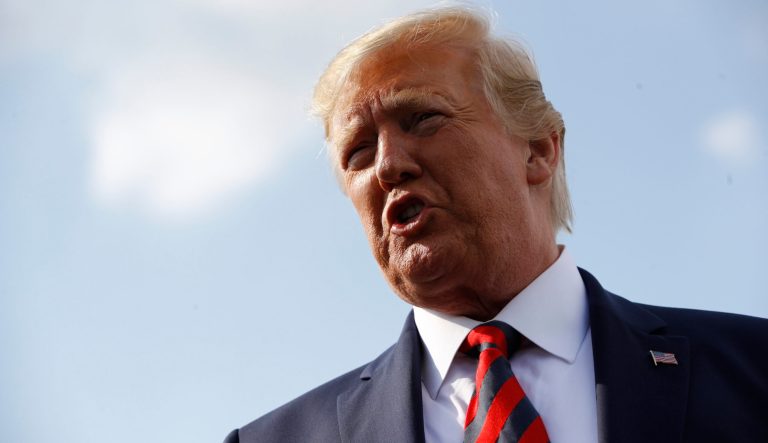 President Donald Trump speaks with reporters before boarding Air Force One with first lady Melania Trump at Morristown Municipal Airport in Morristown, N.J., Sunday, Aug. 18, 2019, en route to Andrews Air Force Base, Md. 