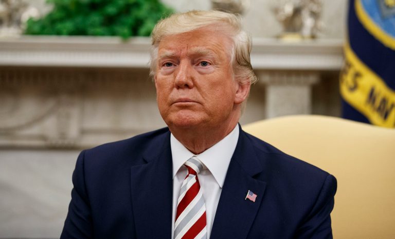 President Donald Trump pauses while speaking during a meeting in the Oval Office of the White House, Tuesday, Aug. 20, 2019, in Washington. 