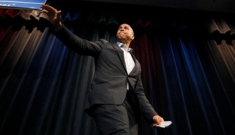 Democratic presidential candidate Sen. Cory Booker walks off stage.