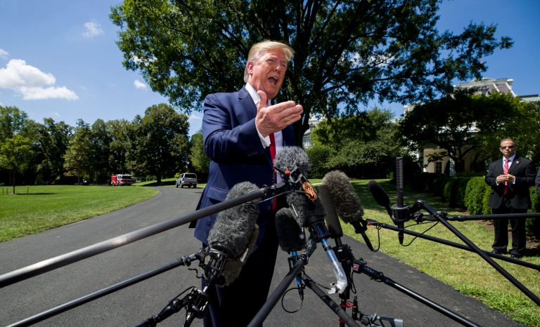 President Donald Trump speaks with reporters before departing on Marine One on the South Lawn of the White House, Wednesday, Aug. 21, 2019, in Washington. 