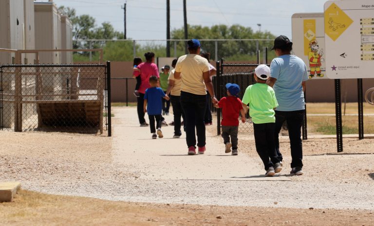 Immigrants seeking asylum leave a cafeteria at the ICE South Texas Family Residential Center, Friday, Aug. 23, 2019, in Dilley, Texas.