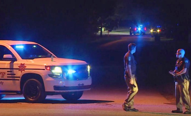In this photo provided by WHNT-TV News, authorities block access to a street, in Elkmont, Ala., Tuesday, Sept. 3, 2019. Authorities in Elkmont say a teenager called 911 about hearing gunshots and then admitted to killing multiple members of his family. 