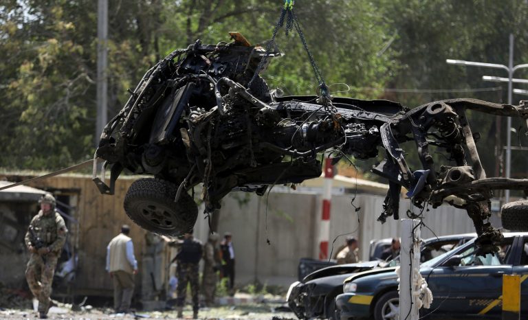 Resolute Support (RS) forces remove a destroyed vehicle after a car bomb explosion in Kabul, Afghanistan, Thursday, Sept. 5, 2019. 