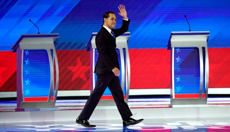 Former Housing and Urban Development Secretary Julian Castro waves on stage.