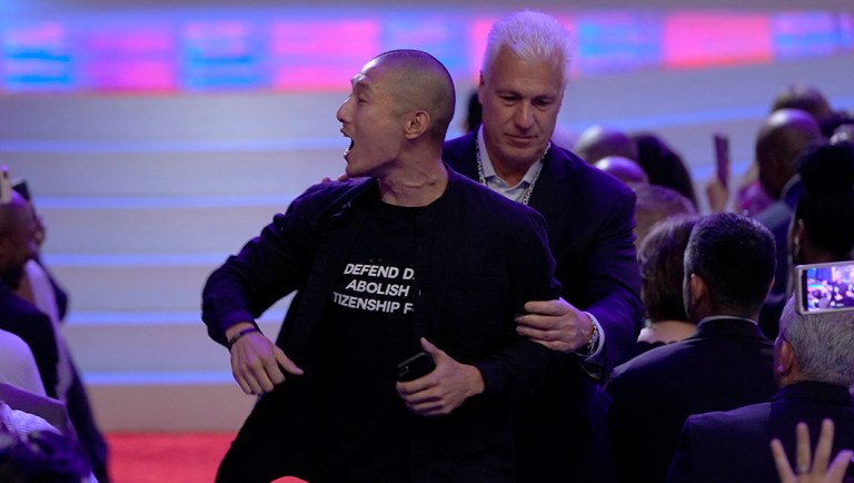 Left-wing protesters interrupt Biden on immigration during Democratic 2020 debate