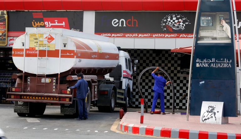 Workers refuel the tank at a gas station in Jiddah, Saudi Arabia, Tuesday, Sept. 17, 2019. 