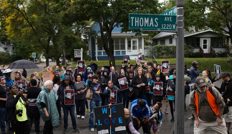 Protesters marching from the Saint Paul Western District headquarters gather at the site of Ronald Davis' death at the hands of St. Paul police in St. Paul, Minnesota.