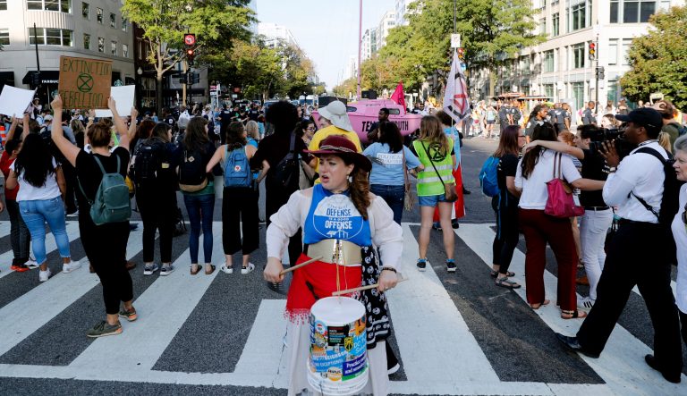 Protesters block the intersection of K and 16th Street NW, near the White House in Washington, Monday, Sept. 23, 2019. A broad coalition of climate and social justice organizations are disrupting the morning rush hour commute. 