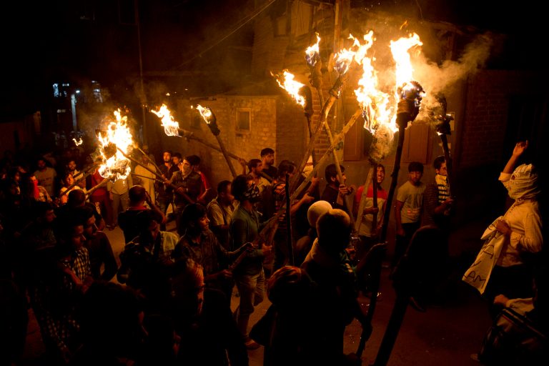 Kashmiri men shout slogans during a torch light march urging world leaders to protest against the Aug. 5 decision by Indian government to strip disputed Jammu and Kashmir of semi-autonomy and statehood, in Srinagar, Indian controlled Kashmir, Thursday, Sept. 26, 2019. 