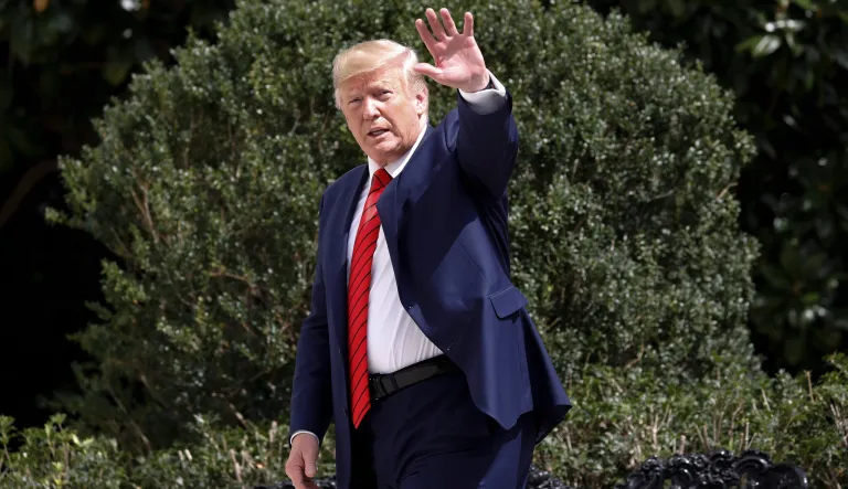 President Donald Trump gestures toward members of the media on the South Lawn of the White House in Washington, Thursday, Sept. 26, 2019, after returning from United Nations General Assembly. 