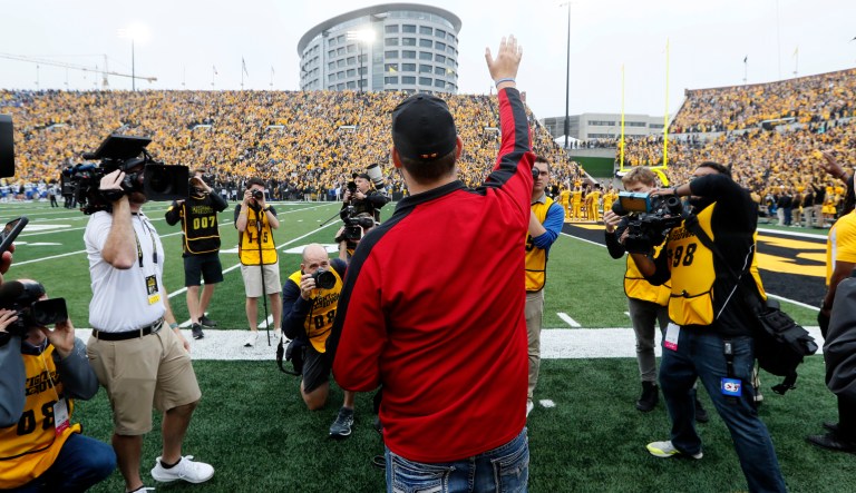 Carson King, of Altoona, Iowa, center, waves to patients in the University of Iowa Stead Family Children's Hospital at the end of the first quarter of an NCAA college football game between Iowa and Middle Tennessee, Saturday, Sept. 28, 2019, in Iowa City, Iowa.