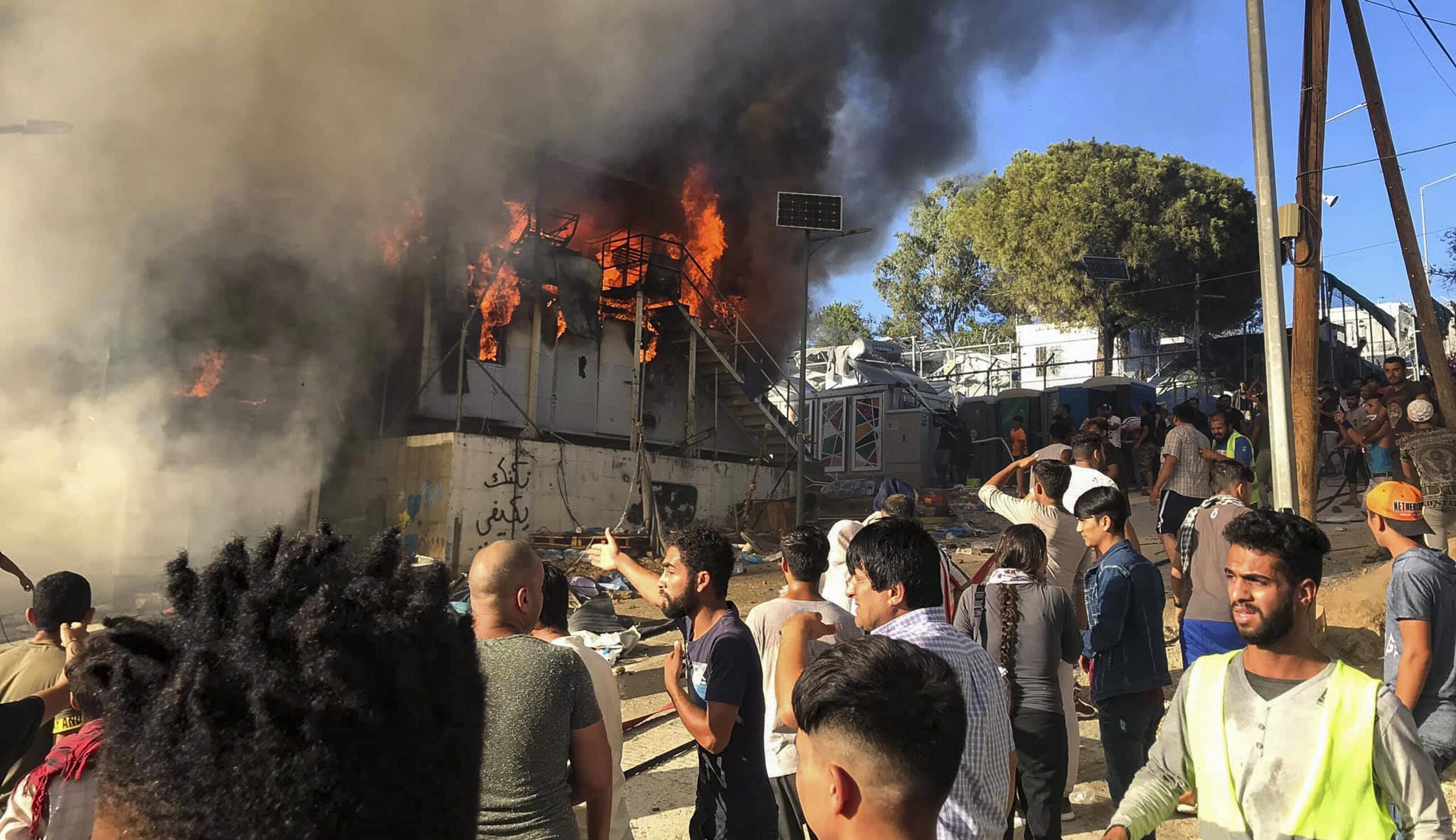 Migrants start fire on Greek island of Lesbos, killing at least one